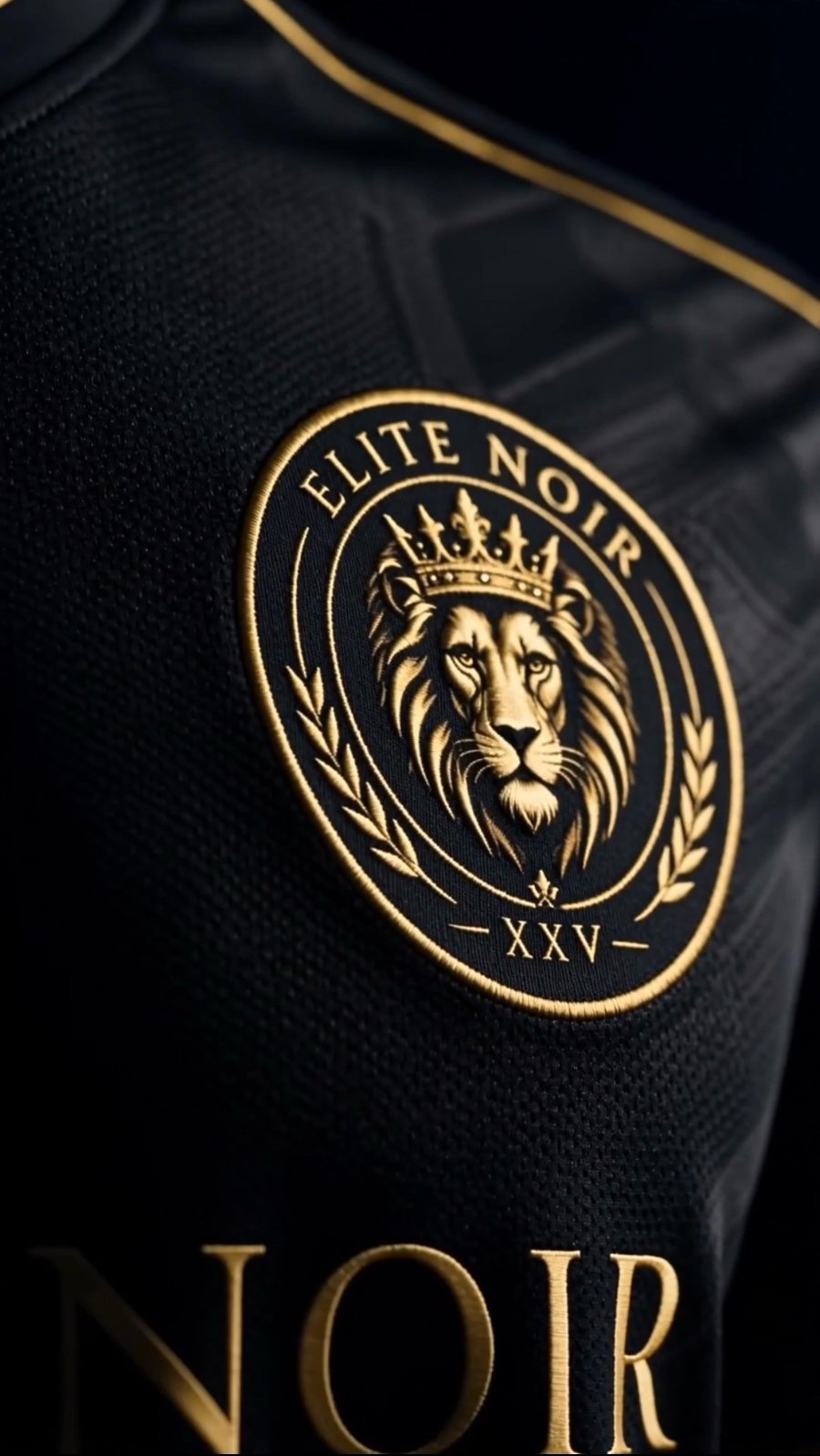 Close-up of the Elite Noir XXV crowned-lion crest embroidered in gold